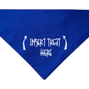 May include: Blue dog bandana with white text that says "Insert Treat Here" with arrows pointing to the text.