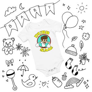 May include: White baby onesie with a cartoon graphic of a person in a boxing pose, with the text "DUBB SAY" in yellow. The word "BABY" is written on a banner above the onesie. The image is surrounded by hand-drawn baby-themed doodles.
