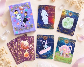May include: A deck of Alice's illusory dream Lenormand cards featuring a purple box with two characters, and four individual cards labelled 1.Rider, 2.Clover, 3.Ship, and 4.House, each displaying colourful illustrations of a horse, clover, rabbit, and house.