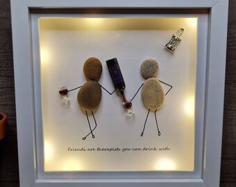 Pebble art family. Pebble art friends gift. Box frame pebble art with lights. Wine glasses and bottle with corkscrew. Friends are therapists