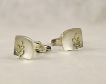 Cufflinks made of 925/- silver with 585/- golden oak leaves