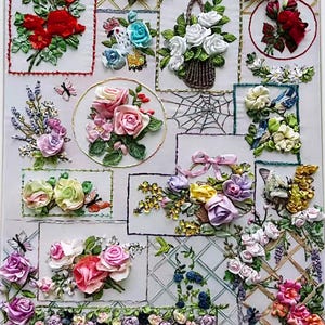 May include: A framed textile artwork displaying ribbon embroidery of diverse floral arrangements. The piece features roses, lavender, and other flowers in various colours. Butterflies and a spiderweb are also incorporated into the design.