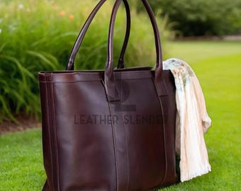 May include: A dark brown leather tote bag with two handles. The bag has a stitched design and the text "LEATHER SLENDER" is visible on the front.