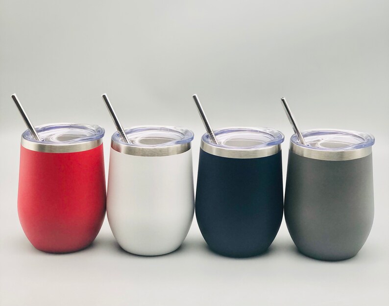 May include: Four stainless steel wine tumblers with lids and straws. The tumblers are red, white, black, and gray.