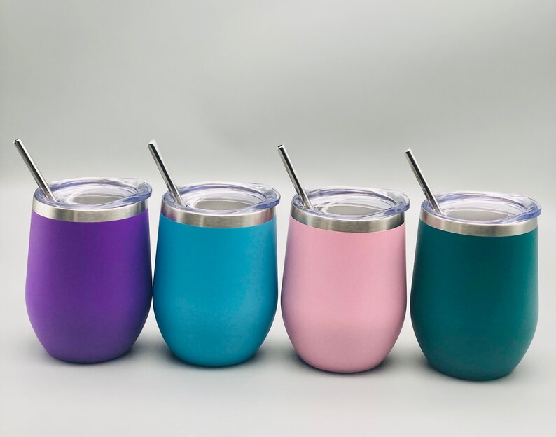 May include: Four stainless steel wine tumblers with lids and straws. The tumblers are purple, blue, pink, and green.