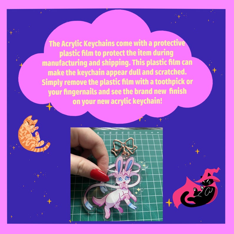 May include: A clear acrylic keychain featuring a pink cartoon bunny with a blue bow. The keychain is being held by a hand with red nail polish. The keychain is on a green grid background.