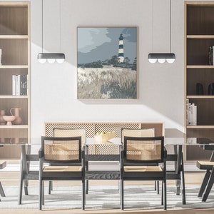 May include: A dining room with a glass table and six black chairs with woven cane seats. The table is set with a bowl of fruit. There are two wooden bookshelves on either side of the table, and a painting of a lighthouse on the wall behind the table.
