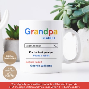 Peut inclure: Une tasse en céramique blanche avec un design de barre de recherche Google. La barre de recherche indique "Grandpa" et le terme de recherche est "Best Grandpa". Les résultats de la recherche indiquent "Found a result" et "George Williams".