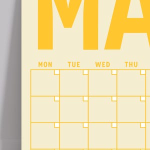 May include: A yellow calendar with the word "MAY" at the top and a grid of squares for each day of the month. The days of the week are labeled "MON", "TUE", "WED", and "THU".