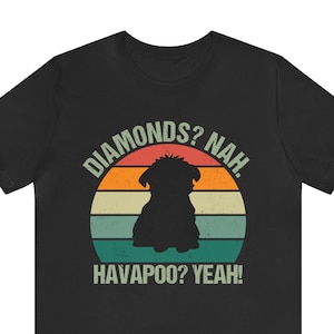 May include: Black t-shirt with a vintage-style graphic of a dog silhouette in front of a sunset. The text reads "Diamonds? Nah. Havapoo? Yeah!"
