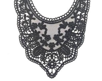 May include: Black lace collar with a delicate floral design. The collar is made of a sheer fabric and has a scalloped edge.