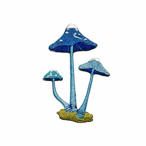 May include: An embroidered patch featuring three blue mushrooms with white spots. The mushrooms have a yellow base and are arranged in a cluster.