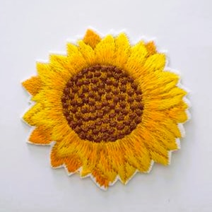 May include: A yellow embroidered sunflower patch with a brown centre. The patch is ideal for adding a touch of nature to clothing, bags, or other crafts.