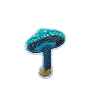May include: An embroidered mushroom patch in blue and green with a gold stem.