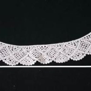 May include: White lace trim with a scalloped edge, measuring 13.5 inches tall and 45.1 inches wide.