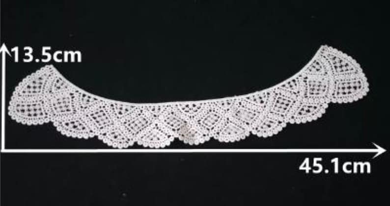 May include: White lace trim with a scalloped edge, measuring 13.5 inches tall and 45.1 inches wide.