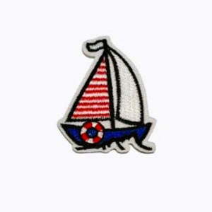 May include: A white sailboat with red and blue stripes on the sail and a blue life preserver. The sailboat is embroidered on a white fabric.