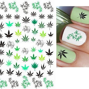 May include: A sheet of nail art stickers with various designs of green marijuana leaves, including some with the text "be jolly".