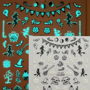 May include: Two sheets of Halloween-themed nail art stickers. One sheet glows in the dark with teal designs of witches, bats, cauldrons, and moons. The other sheet has black and white designs of similar Halloween icons.