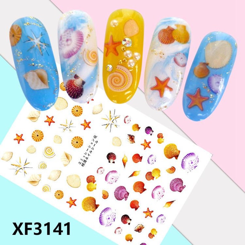 May include: A sheet of nail art stickers with a variety of seashells, starfish, and swirls in shades of blue, yellow, orange, and purple. The sheet also includes the text "XF3141".