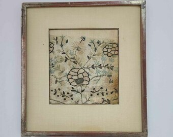 A small antique English embroidery framed