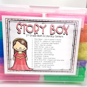 May include: A colorful plastic storage box with a label that reads "STORY BOX 2nd Grade Math & Literacy Centers". The label lists 16 different activities, each with a title and a short description. The box is filled with smaller plastic containers, each a different color.