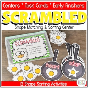 May include: A Scrambled Shape Matching and Sorting Center educational kit featuring a clear zippered pouch with instructions, egg-shaped cutouts, and frying pan cutouts labeled with shape names like heart and star in red text.