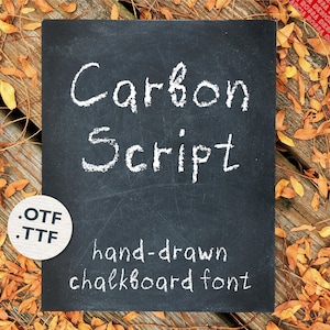 May include: A black chalkboard with white chalk writing that says "Carbon Script" and "hand-drawn chalkboard font". The chalkboard is surrounded by brown leaves.