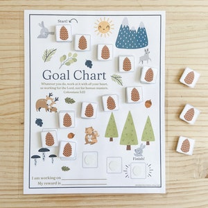 May include: A printable goal chart with a woodland theme. The chart features a path with pine cones to mark progress, a sun, mountains, and a deer. The text on the chart reads "Goal Chart" and "Whatever you do, work at it with all your heart, as working for the Lord, not for human masters. Colossians 3:23".