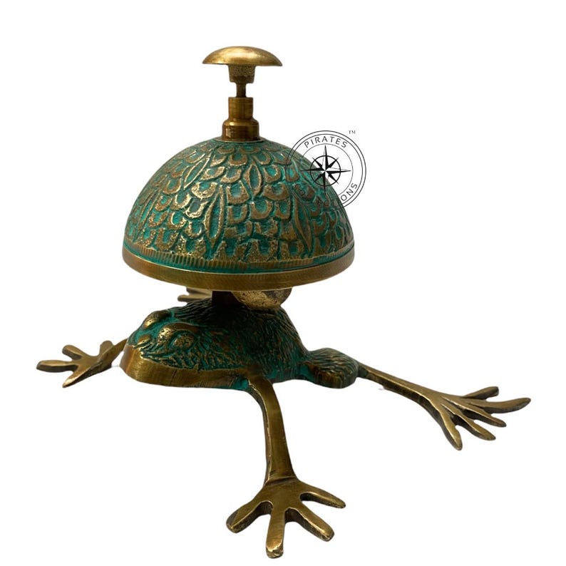 May include: A brass frog-shaped door bell with a green patina finish. The bell has a dome-shaped top with an intricate design.
