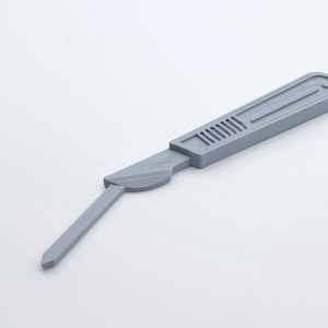 May include: A gray plastic scalpel with a handle and a blade. The blade is pointed and the handle has a textured grip.