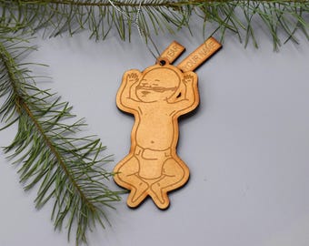 May include: Wooden Christmas ornament shaped like a baby with the text "YEAR" and "YOUR NAME" on the top.
