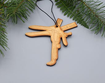 May include: Wooden Christmas ornament shaped like a plane with the year 2021 and the text "YOUR NAME" on it.