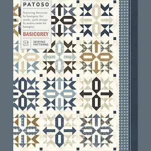 May include: Sewing pattern for a quilt featuring a geometric design with blue, brown, and white squares. The pattern is called "Pat 050" and is by BasicGrey.