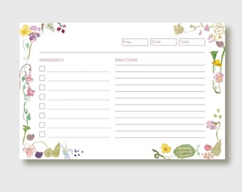May include: A white recipe card with floral watercolor illustrations in yellow, pink, and purple. The card has sections for ingredients, directions, and prep, cook, and total times. The floral design borders the edges.