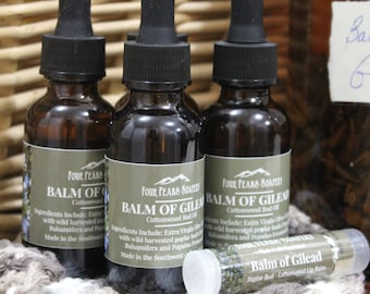 May include: Three amber glass bottles with dropper tops, each labeled "Balm of Gilead Cottonwood Bud Oil" and a smaller tube labeled "Balm of Gilead Poplar Bud Cottonwood Lip Balm".