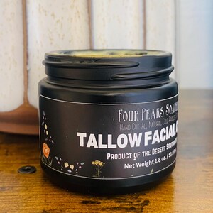 May include: A black jar of Tallow Facial cream with a black lid. The label reads "Four Peaks Soap" and "Product of the Desert Southwest." The net weight is 1.8 oz. Floral illustrations decorate the label.