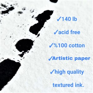 May include: A close-up of a white textured paper with black ink splatters. The paper is 140 lb, acid free, 100% cotton, artistic paper, high quality, and has textured ink.