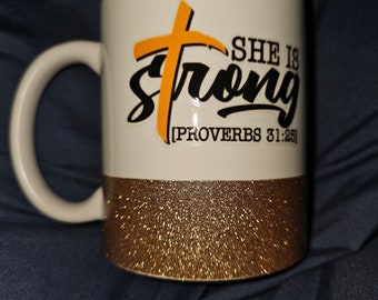 She is Strong ceramic coffee mug with gold glitter