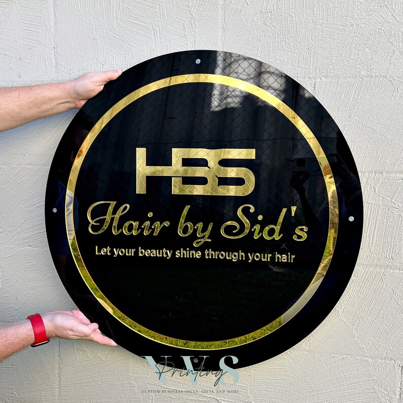 May include: A black and gold round sign with the text "HSS Hair by Sid's" and the tagline "Let your beauty shine through your hair".