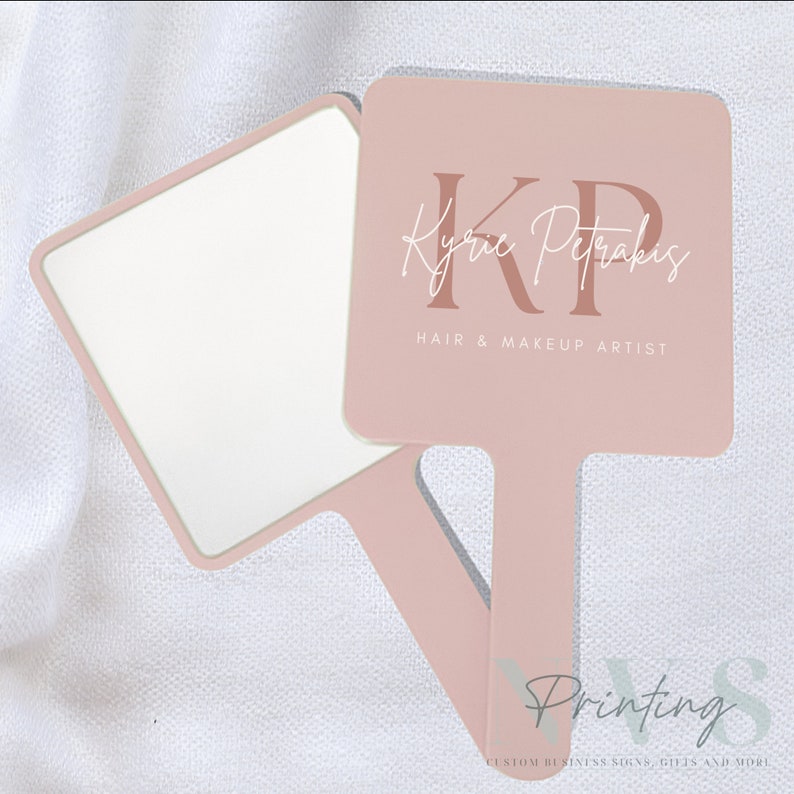 Personalised Handheld Mirror for Make Up Artist in blush pink color with printed business logo on it in white and taupe, KP hair and make up artist logo, custom print mirror for salon hairdresser lash tech or brow tech and any beautician, bridal gift