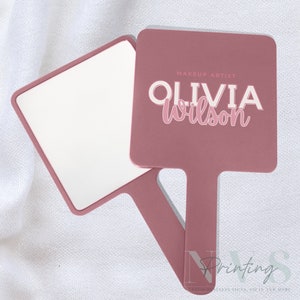 Personalised Handheld Mirror for Make Up Artist in dusty pink colour with printed business logo on it , Olivia Wilson make up artist logo, custom print mirror for salon hairdresser lash tech or brow tech and any beautician, bridal gift