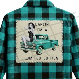 May include: A teal and black plaid flannel shirt with a patch featuring a vintage pin-up girl sitting on a teal pickup truck. The patch reads "Darlin' I'm a Limited Edition."