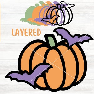 May include: Layered SVG cut file design of an orange pumpkin with a purple bat flying above it. The text "LAYERED" is visible in the background.