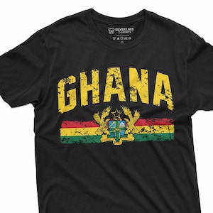 May include: Black t-shirt with a yellow distressed graphic of the word "GHANA" and the Ghanaian flag with the coat of arms.