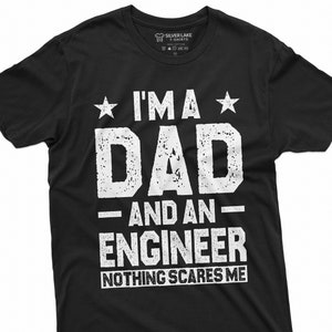 Puede incluir: Camiseta negra con texto blanco que dice "Soy un papá y un ingeniero - Nada me asusta".