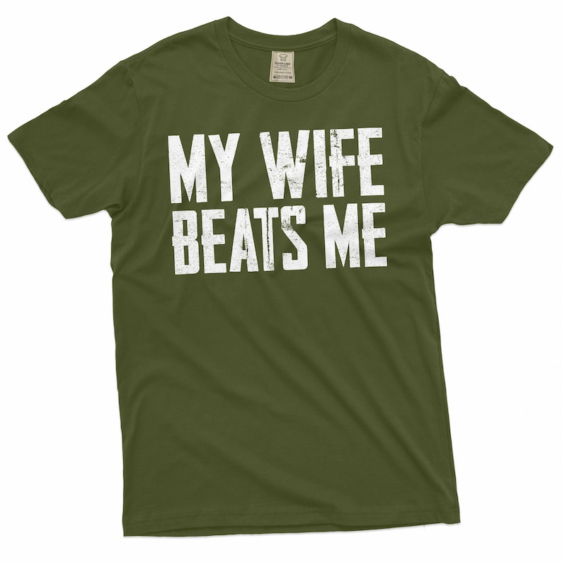 May include: A green t-shirt with the text "MY WIFE BEATS ME" printed in white.