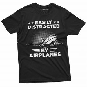 May include: Black t-shirt with white text that reads "Easily Distracted By Airplanes" and a white airplane graphic.