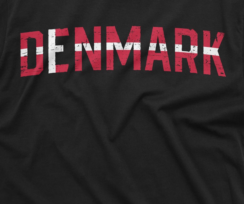 May include: Black t-shirt with the word "DENMARK" printed in red and white, resembling the Danish flag.