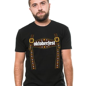 May include: Black t-shirt featuring a brown and white graphic of braces and the word "Oktoberfest" in white.